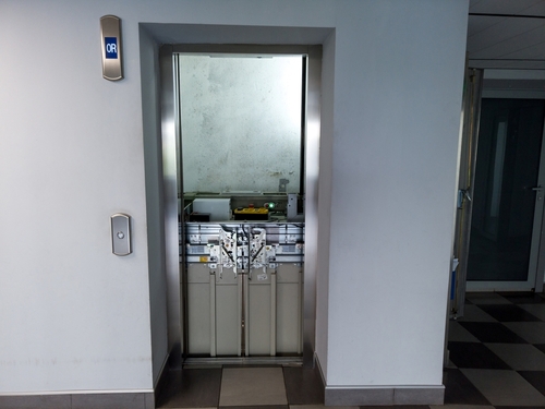 Broken elevator in open lift shaft